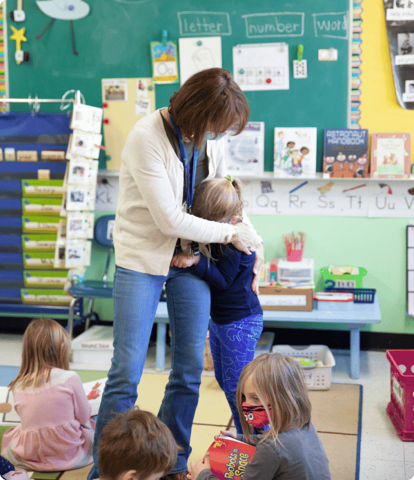 teacher hugging student